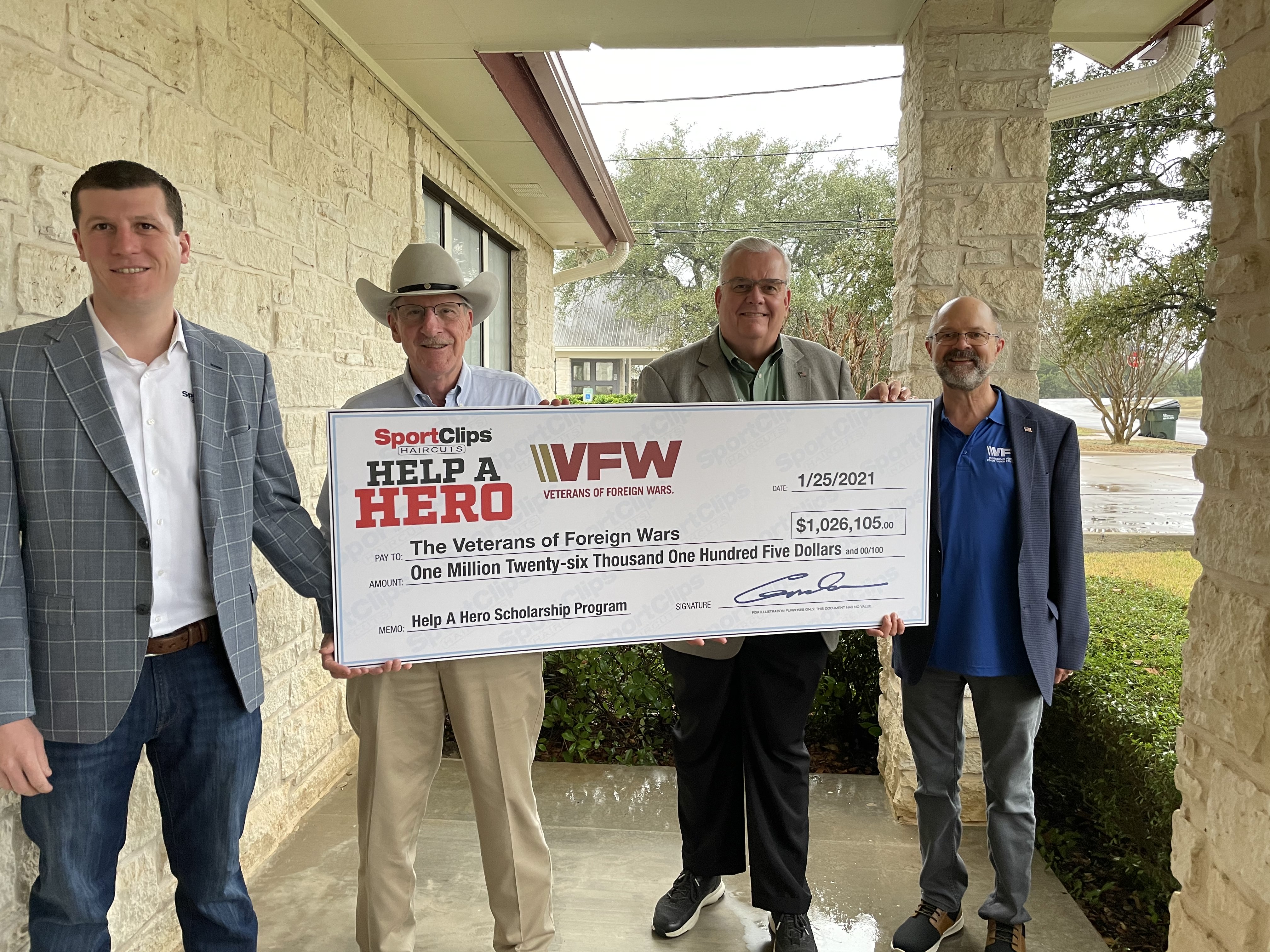 Edward & Gordan Logan Hold Donated Check for the VFW