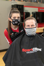 Stylist in mask with client in mask