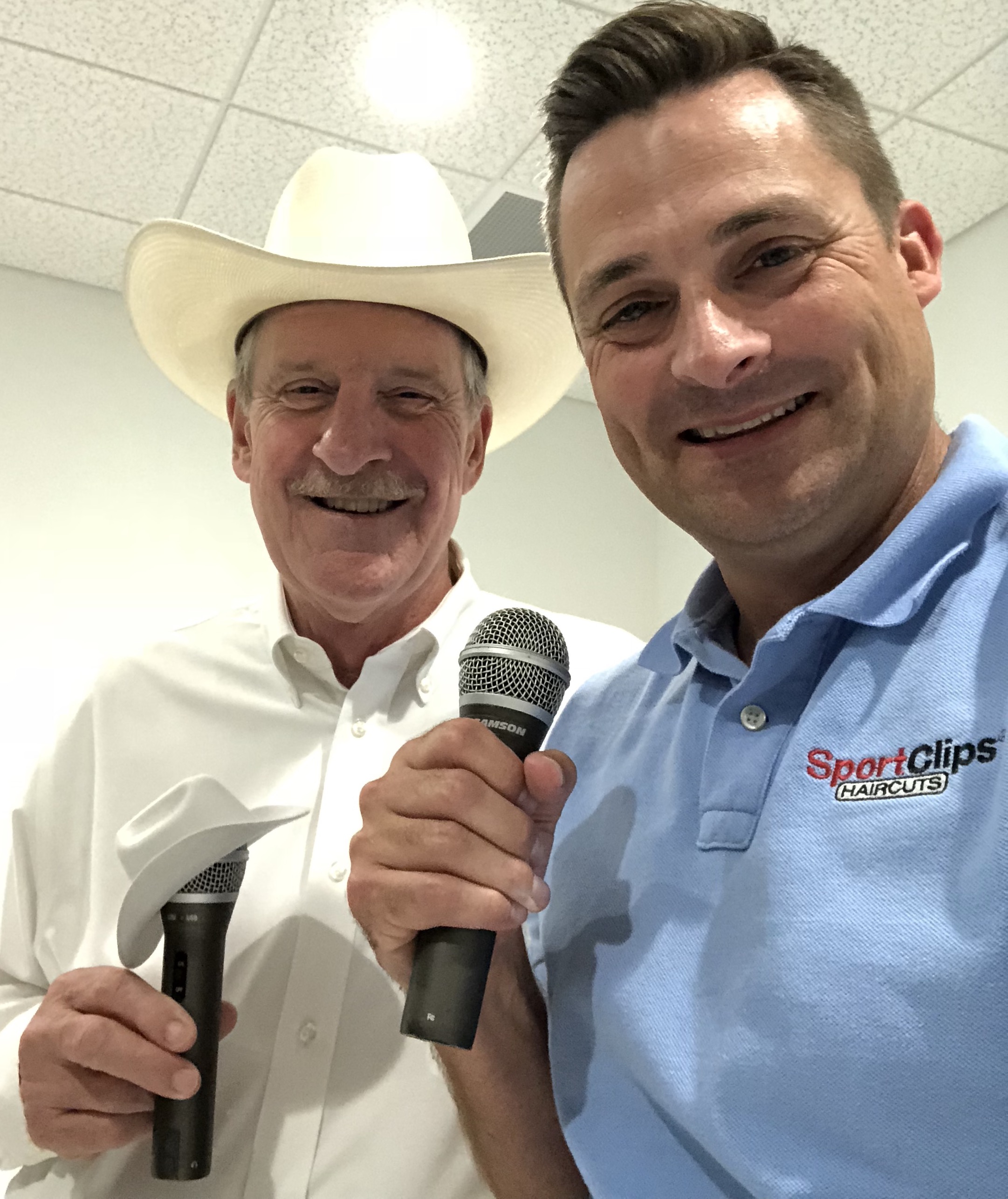 Gordon Logan and Chad Jordan holding microphones